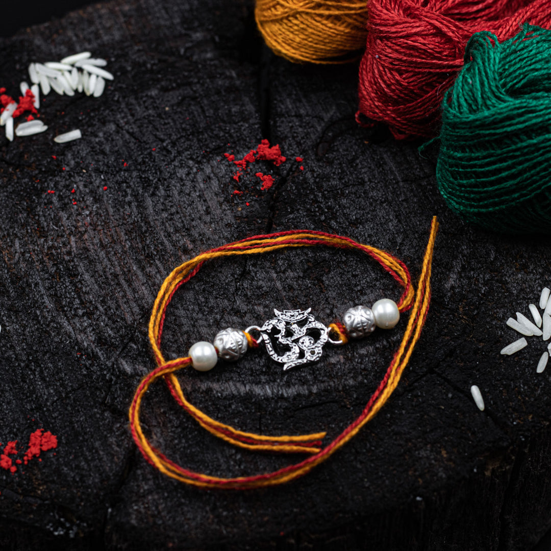 “Divine harmony” OM Silver Rakhi