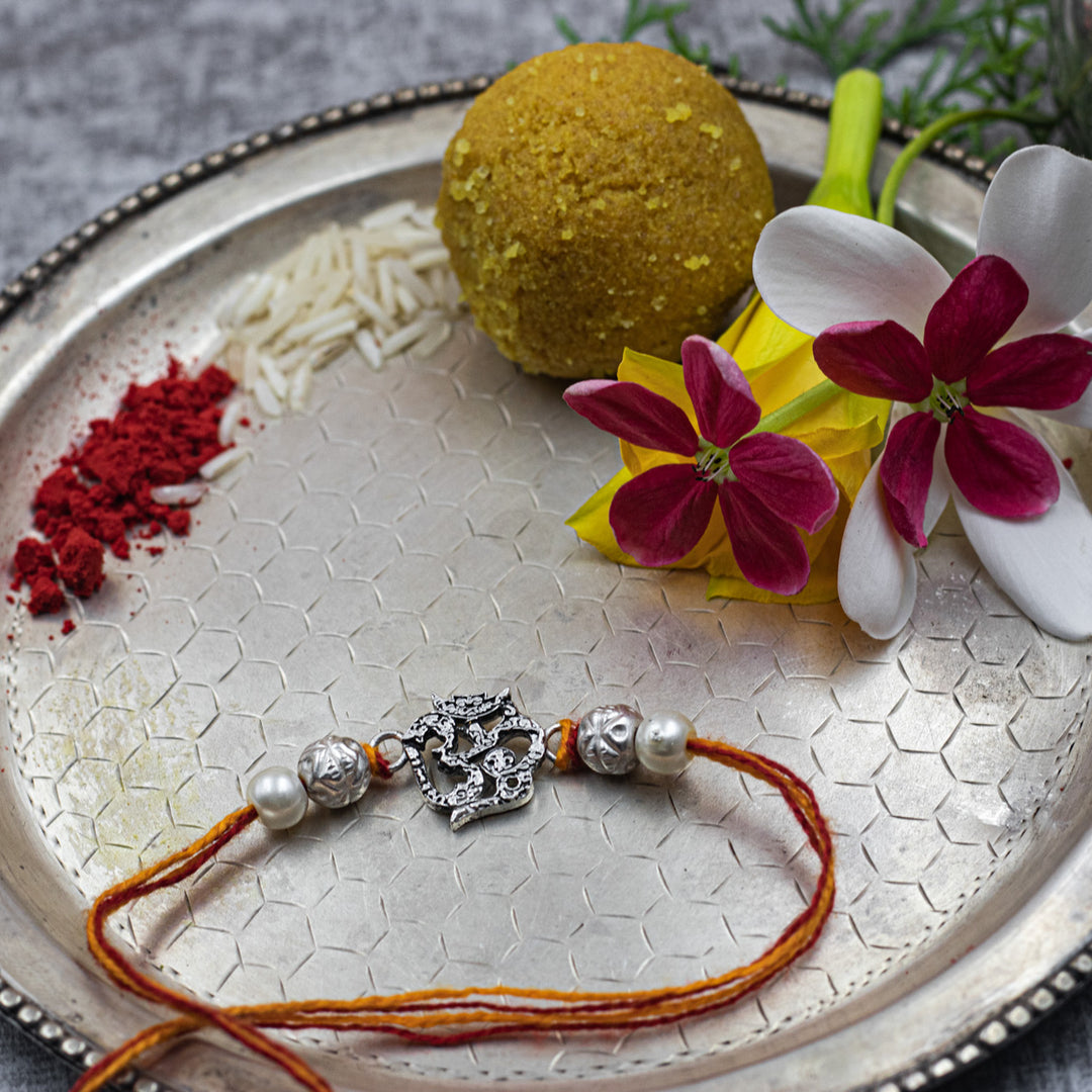“Divine harmony” OM Silver Rakhi